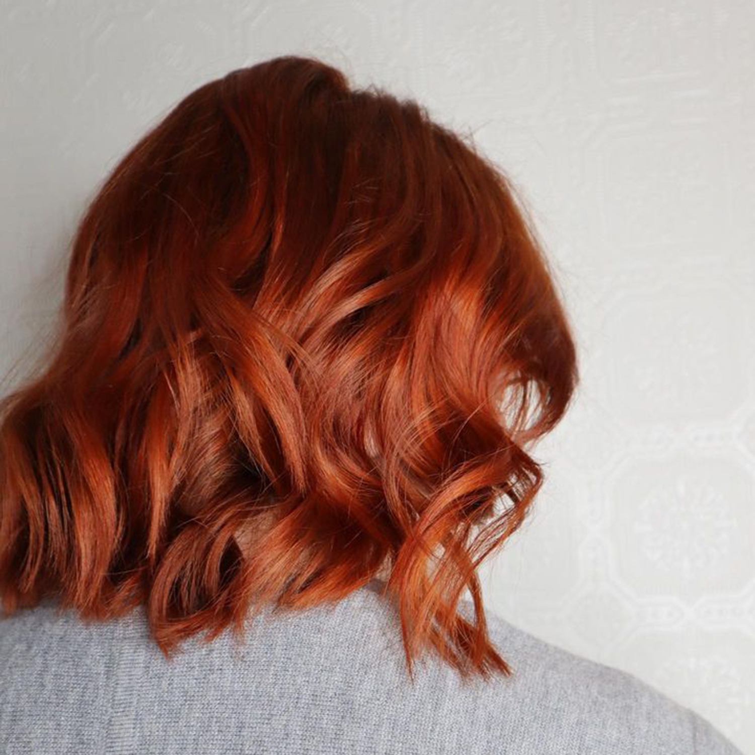 woman's red bob haircut